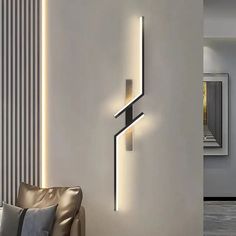 a modern wall light in the corner of a room