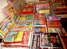 a pile of children's books sitting on top of a floor next to a window