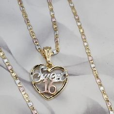 two necklaces with the word love written on them and a heart shaped pendant attached to it