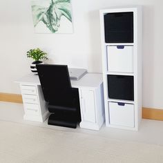 a white desk with drawers and a black chair