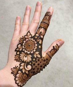 the hand is decorated with intricate designs