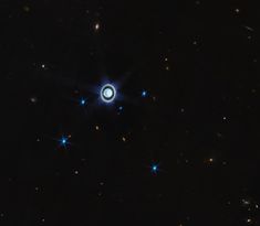 an image of some stars in the night sky with blue lights on them and black background