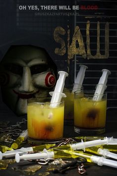 two glasses filled with yellow liquid next to an evil clown's face and the words sawu