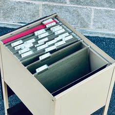 an open file cabinet with files in it