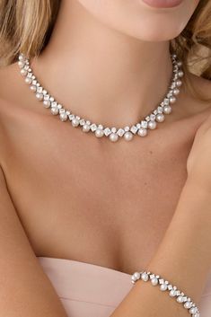 Introducing our stunning DARA Simulated Diamond Necklace featuring square and round shaped simulated diamonds and natural colored pearls for the perfect amount for sophistication and sparkle. The ELLEE extension on the necklace is the perfect touch to adjust to any neckline to complete your look. Handcrafted with the Highest Quality Necklace 16" length + 3" extension Crystal Colors - White Highest Grade Cubic Zirconia and Faux Natural Colored Crystals Platinum plated for lasting quality and shin Diamond And Pearl Necklace, Jewelry Accessories Rings, Colored Pearls, Rose Gold Tiara, Bridal Hair Combs Pearl, Crystal Colors, Pearl Headpiece, Crown Earrings, Gold Headpiece