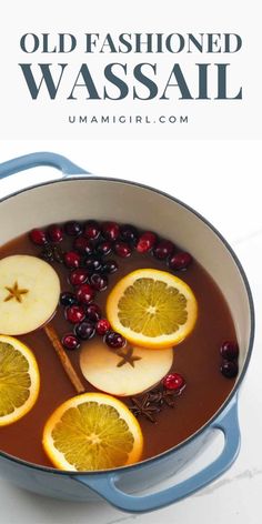 an old fashioned wassail recipe with oranges and cranberries in a pot