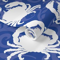 a blue and white wallpaper with an intricate design on it's surface,