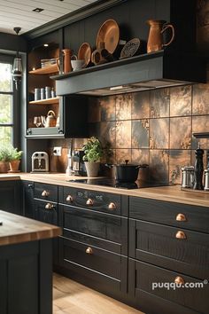 a kitchen with black cabinets and wooden counter tops, pots and pans on the shelves