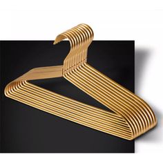 wooden clothes hanger on black background