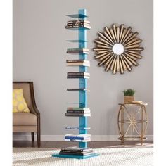 a tall book stand with many books on it in front of a chair and mirror