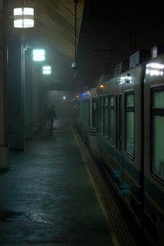 the train is stopped at the station in the dark