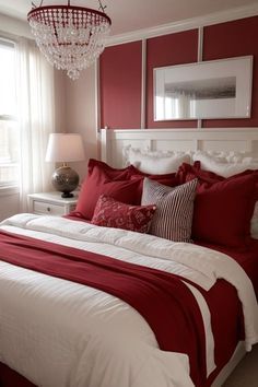 a red and white bedroom with a chandelier