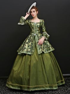 This unique green shown color ball gown will ensure that all eyes are on you on the occasion you want to attend. Featuring a square neckline and vintage on the bodice of the satin fabric of the dress. You are bound to show off your beauty on this long sleeve and style having a lace up back style at the back of the bodice. This dress is a floor length gown, that dances along to the breeze on that special occasion. This dress is well crafted with prints throughout the skirt of the ball gown. Lunch this alluring gown on your big occasion. Victorian Dress Costume, Masquerade Gown, Victorian Ball Gowns, Masquerade Ball Gowns, Era Victoria, Gaun Abad Pertengahan, Green Ball Gown, Masquerade Ball Gown, Antoinette Dress