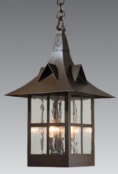 an old fashioned hanging lantern with three lights