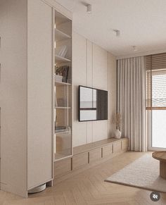 a living room filled with furniture and a flat screen tv on top of a wooden shelf