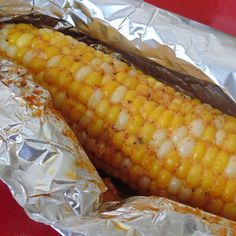 grilled corn on the cob wrapped in aluminum foil