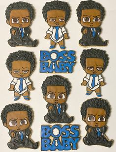 the boss baby cookies are decorated with black men's hair and blue tie on them