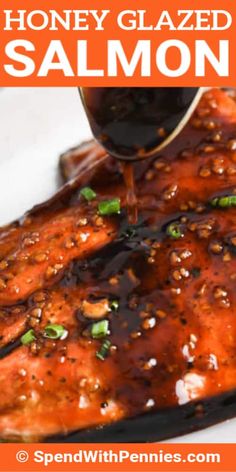 honey glazed salmon is being drizzled with sauce