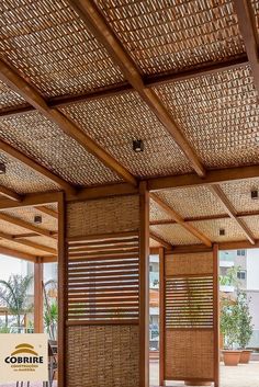 the inside of a building with wooden slats