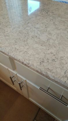 a kitchen counter top with drawers underneath it