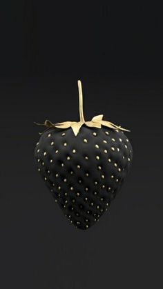 a close up of a strawberries on a black background with gold dots in the center