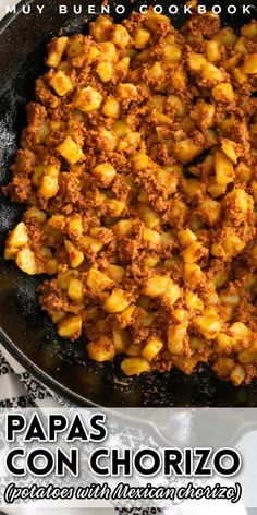 a skillet filled with food sitting on top of a white and black table cloth