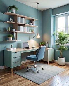 an office with blue walls and wooden flooring is pictured in this image, there is a desk that has a laptop on it