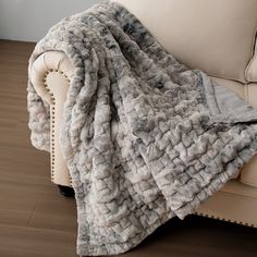 a couch with a blanket on top of it