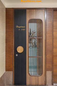 a wooden door with metal bars on the front and side panels that lead into an indoor swimming pool