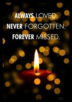 a candle with the words, always loved never forgotten forever missed