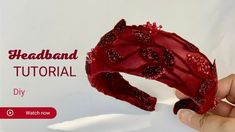 a hand holding up a red piece of fabric with the words headband on it