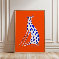 a blue and white spotted dog sitting on an orange background