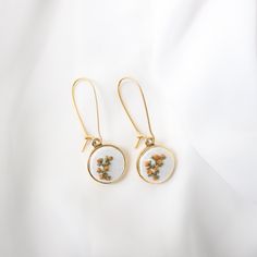 Flowers that last a lifetime! These floral inspired cottage core hand-embroidered dangle earrings are perfect for everyday wear as they are minimalist and add a unique touch to any outfit. These earrings make a thoughtful gift for a birthday, anniversary, Christmas or any other special occasion. The simple yet elegant style is perfect for the nature loving lady. Each pair of earrings comes packaged in a little black box, perfect for gifting. ITEM DETAILS: - All orders are packaged gift-ready wet Rustic Wedding Jewelry, Cottage Core Jewelry, Wedding Jewelry Gold, Cottagecore Earrings, Gold Minimalist Jewelry, Embroidered Earrings, Romantic Academia, Embroidered Jewelry, Teacher Clothes