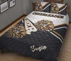 this is a bed with cheerleader comforter and pillow cases on the bottom half