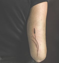 a person with a small tattoo on their arm