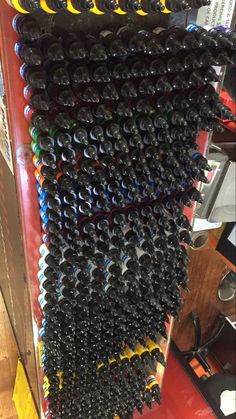 several rows of wine bottles stacked on top of each other