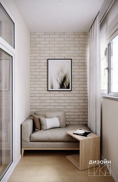 a living room with a couch, coffee table and window