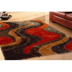 a living room with red couches and brown rugs