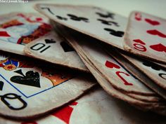 a pile of playing cards sitting on top of each other