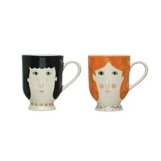 two coffee mugs with faces on them, one is orange and the other is black