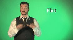 a man standing in front of a green screen with the words flirt written on it