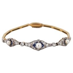 A former bracelet in a geometric Art Deco style from the 1920s. The bracelet is being examined in a gemological laboratory Made of 0.750 yellow gold and platinum. Set with diamonds with a total weight of approx. 0.76ct, sapphires and pearls. A beautiful timeless classic of elegance. Length 15.5cm Weight 9.1g The purchase is accompanied by a jewelry certificate from a gemological laboratory. 1920s Bracelet, Art Deco Jewelry 1920s, Bracelet With Diamonds, Jewelry Certificate, Art Deco Bracelet, Estilo Art Deco, The 1920s, Art Deco Jewelry, Diamond Bracelets