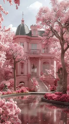 a large pink house surrounded by trees and flowers