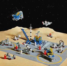 an advertisement for lego space station with astronauts and vehicles in the foreground, on a desert surface