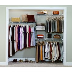 a woman sitting on the floor in front of a closet