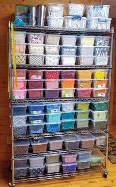 the shelves are filled with many different types of crafting supplies and storage bins