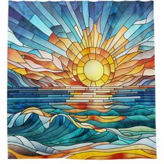 a stained glass window with the sun setting over water and waves in front of it