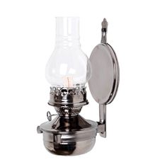 an old fashioned silver oil lamp on a white background