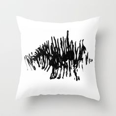 a black and white painting on a pillow