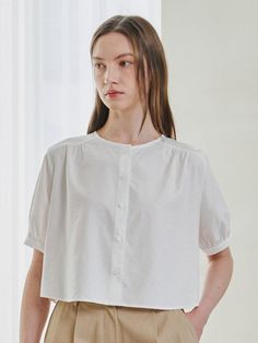 Softly structured, this effortless blouse.It is exceptionally soft and durable.Great outfits start here. - Meet our crisp and light weight blouse- Button up and round neck - It's less likely to wrinkle - Cropped length and rounded hem - Our fabric gives this shirt flexible comfort and it hugs your silhouette- Puff sleeve with buttoned cuffs Summer Crew Neck Blouse With Button Closure, Crew Neck Cotton Blouse With Button Closure, Summer Crew Neck Blouse For Daywear, Feminine Tops With Button Cuffs For Daywear, Summer Daywear Blouse With Crew Neck, Versatile Everyday Tops With Button Cuffs, Chic Crew Neck Tops With Button Closure, Workwear Tops With Button Cuffs, Crew Neck, Crew Neck Tops With Button Cuffs For Work